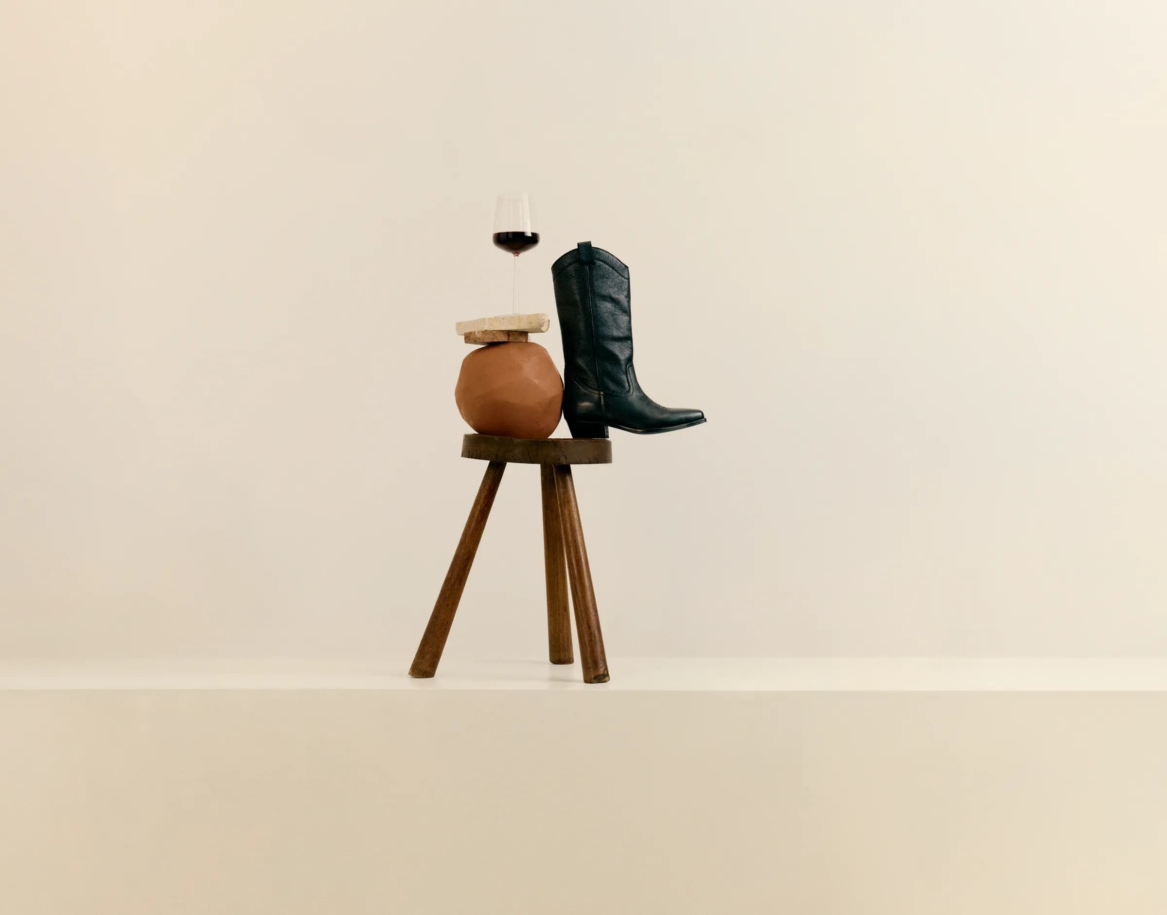 Boot, glass, and stool