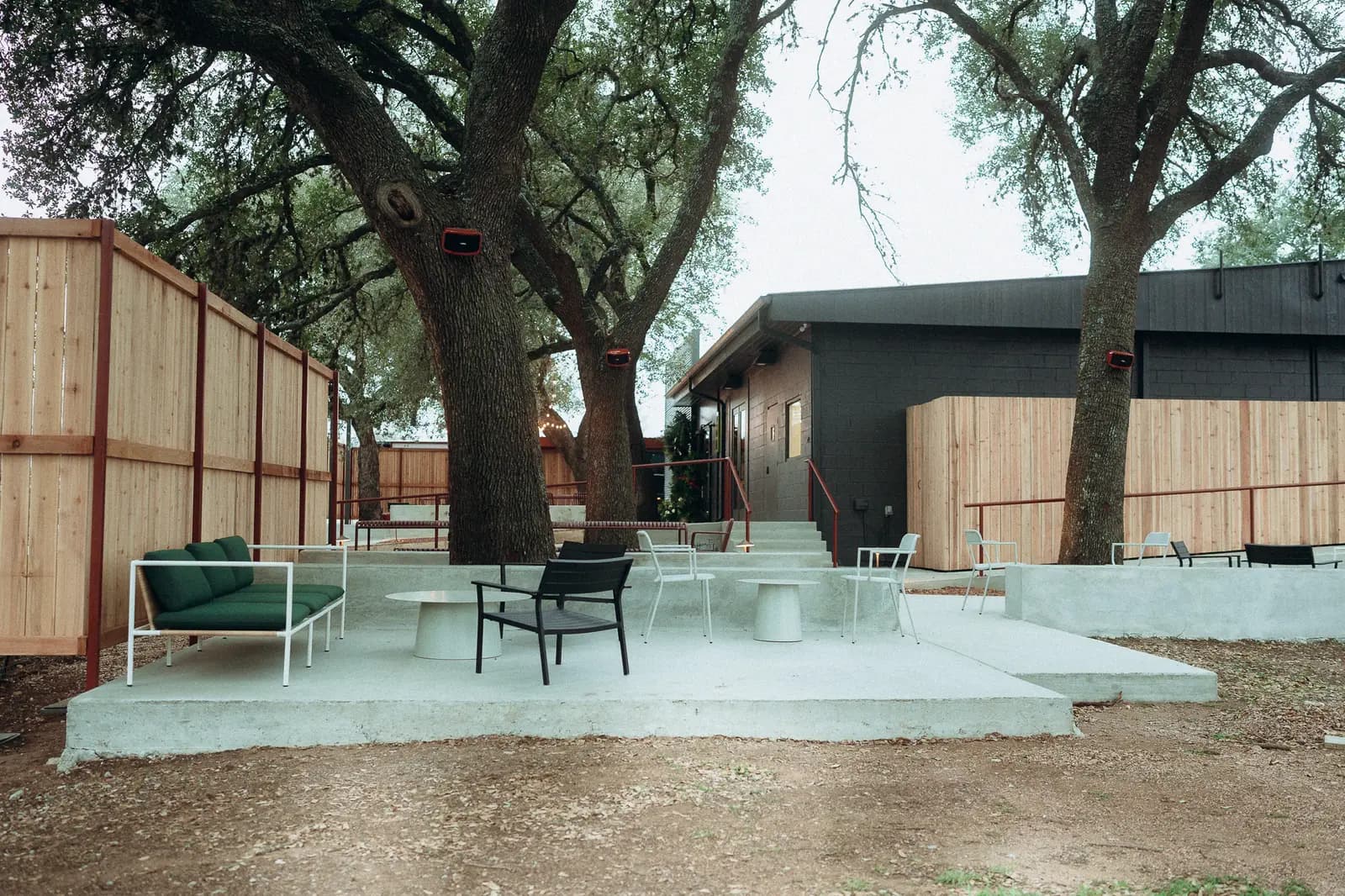 The outdoor patio under live oaks at the Stonewall tasting room
